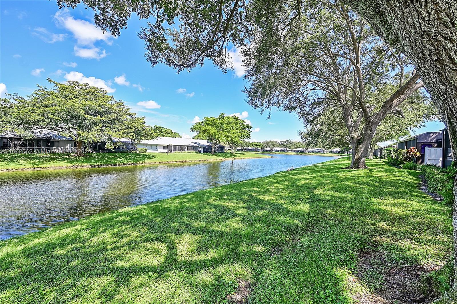 8913 Windtree Street Boca Raton, FL 33496 - Photo 2 of 30 Tranquil Lake view from outside the lanai