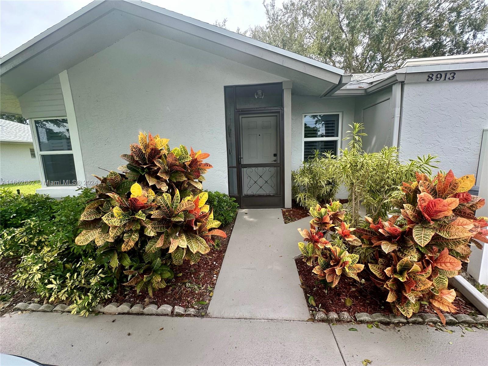 8913 Windtree Street Boca Raton, FL 33496 - Photo 25 of 30 Colorful landscape at the front entrance