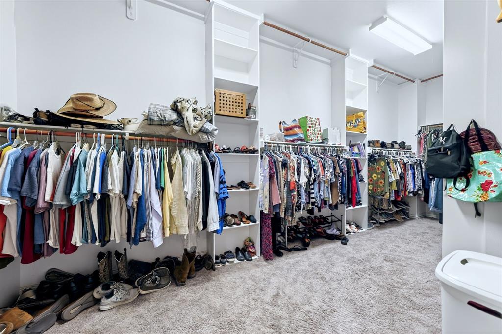 16810 Valley View Forney, TX 75126 - Photo 33 of 40 Massive Primary closet with functional custom built ins,, large full length mirror and more. A true fashionista dream room.