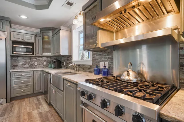a dining room with furniture and wooden floor