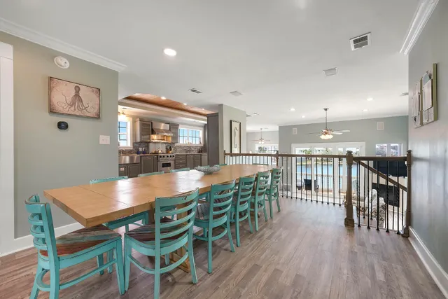a bedroom with a large bed and a flat tv screen