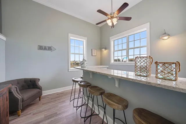 a bedroom with a bed and a large mirror