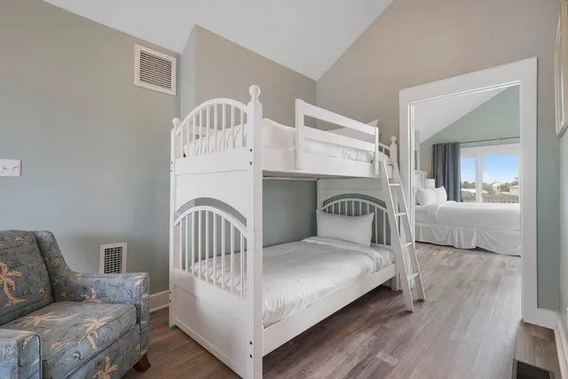 a bedroom with a bed and cabinets