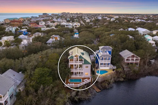an aerial view of a house with a lake view