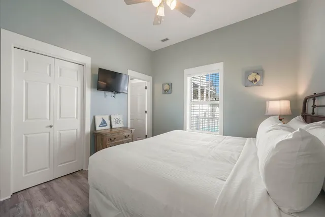 a bedroom with a large bed and a large window