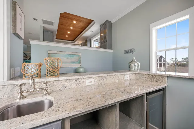 an aerial view of a house with outdoor space and lake view