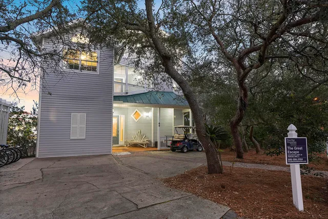 a large kitchen with granite countertop a large counter top space a sink stainless steel appliances and cabinets