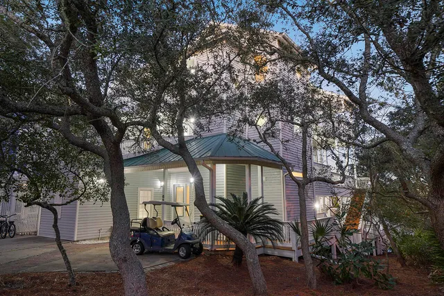 a kitchen with stainless steel appliances kitchen island granite countertop a kitchen island a stove a dining table and chairs