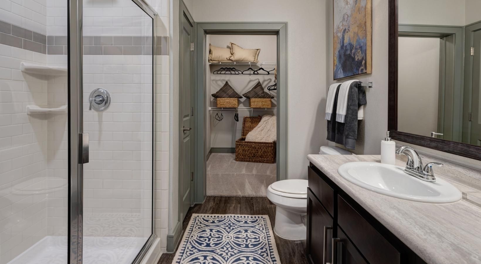 2539 Spring Cypress Road, Unit 7209 Spring, TX 77388 - Photo 4 of 13 a bathroom with a sink a toilet and shower