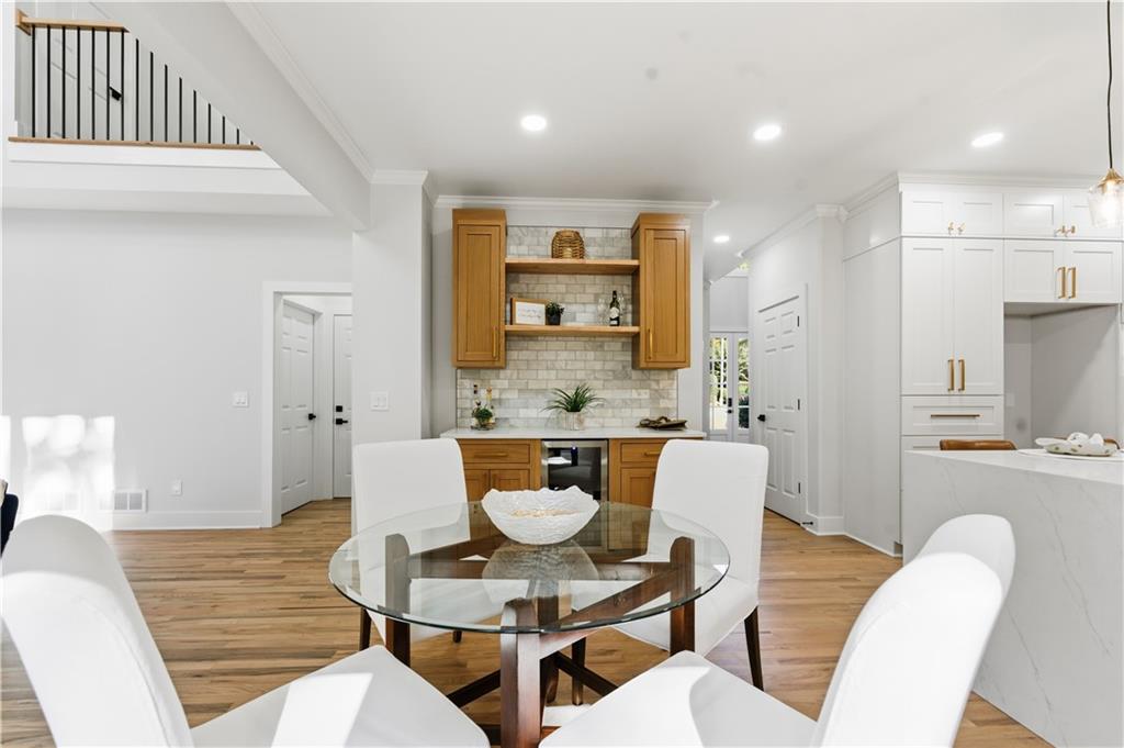 435 Lakepoint Trace Canton, GA 30114 - Photo 14 of 80 a view of a dining room with furniture and wooden floor