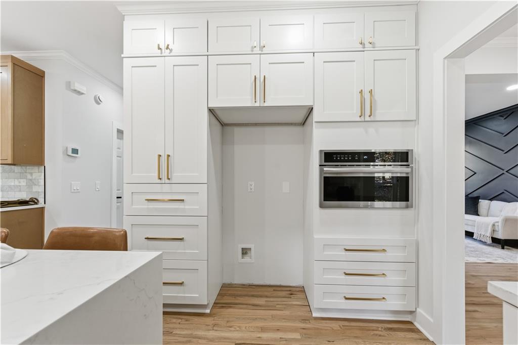 435 Lakepoint Trace Canton, GA 30114 - Photo 16 of 80 a kitchen with stainless steel appliances a refrigerator and cabinets