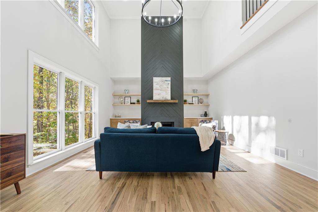435 Lakepoint Trace Canton, GA 30114 - Photo 17 of 80 a living room with furniture and a fireplace