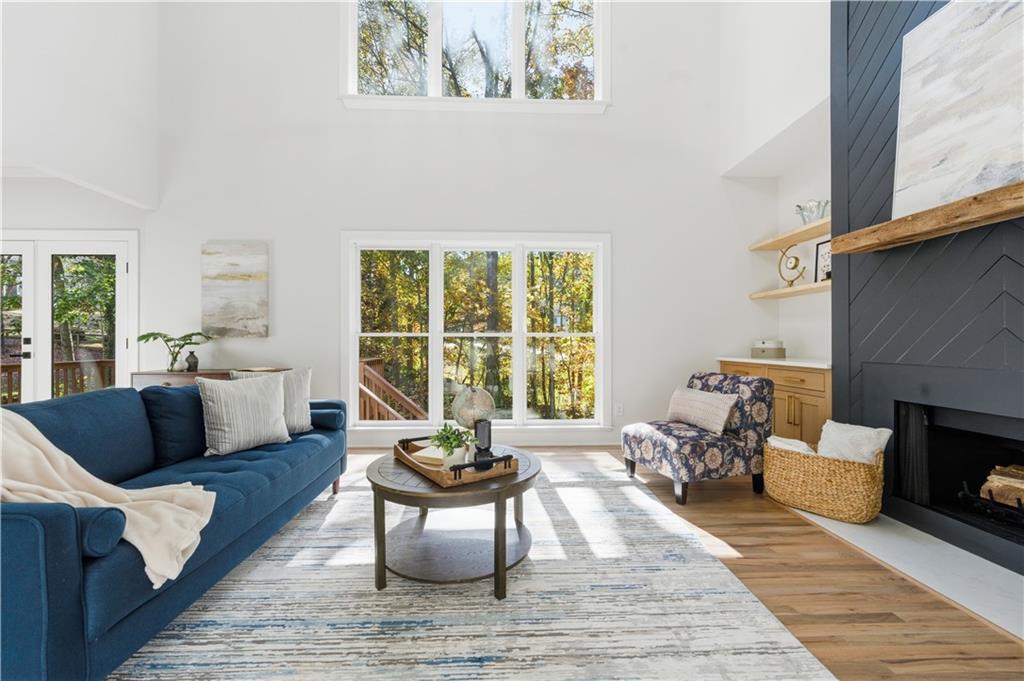 435 Lakepoint Trace Canton, GA 30114 - Photo 19 of 80 a living room with furniture and a fireplace