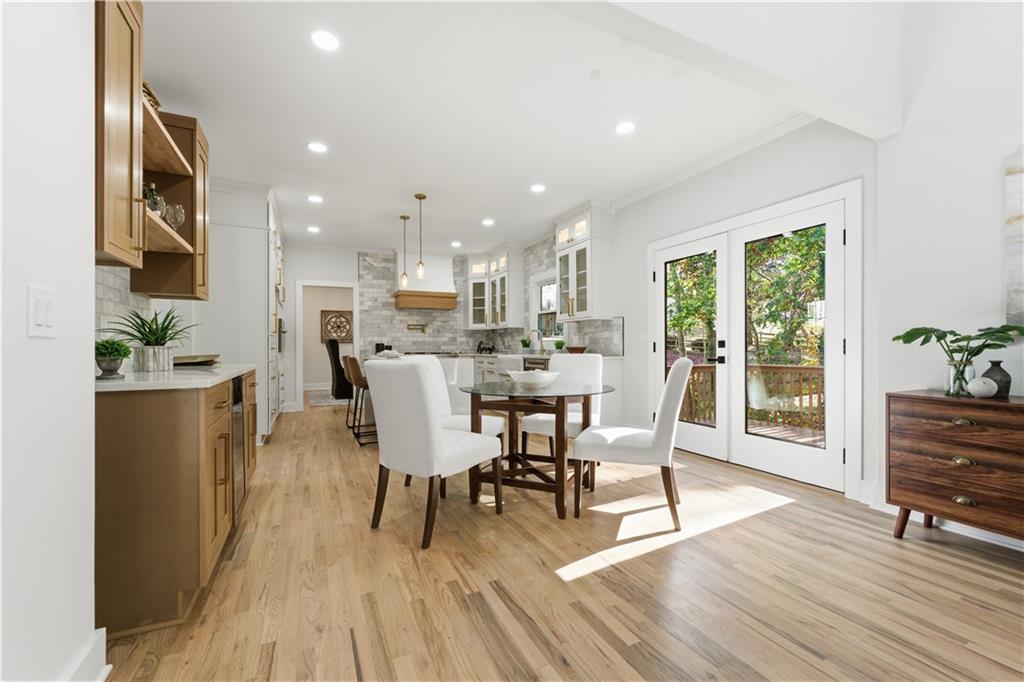 435 Lakepoint Trace Canton, GA 30114 - Photo 20 of 80 a view of a dining room with furniture window and wooden floor
