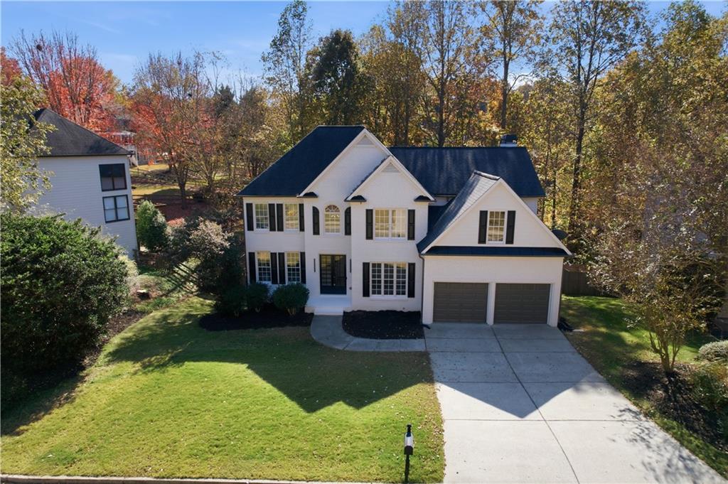 435 Lakepoint Trace Canton, GA 30114 - Photo 2 of 80 a front view of a house with garden