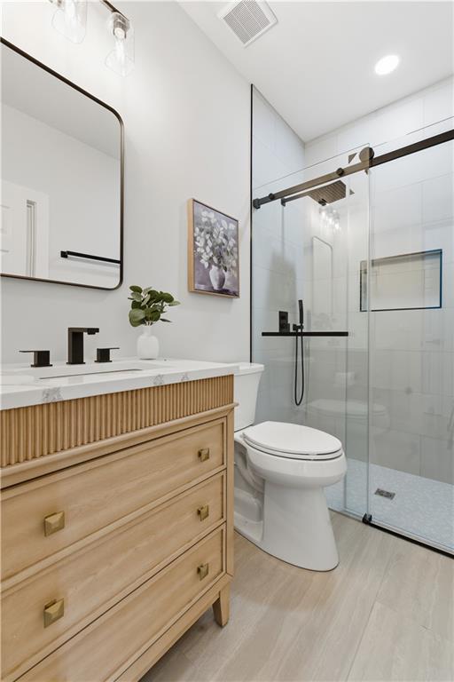 435 Lakepoint Trace Canton, GA 30114 - Photo 22 of 80 a bathroom with a toilet a sink and shower
