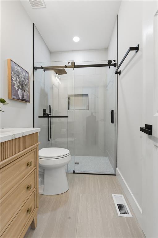 435 Lakepoint Trace Canton, GA 30114 - Photo 23 of 80 a bathroom with a toilet and a shower