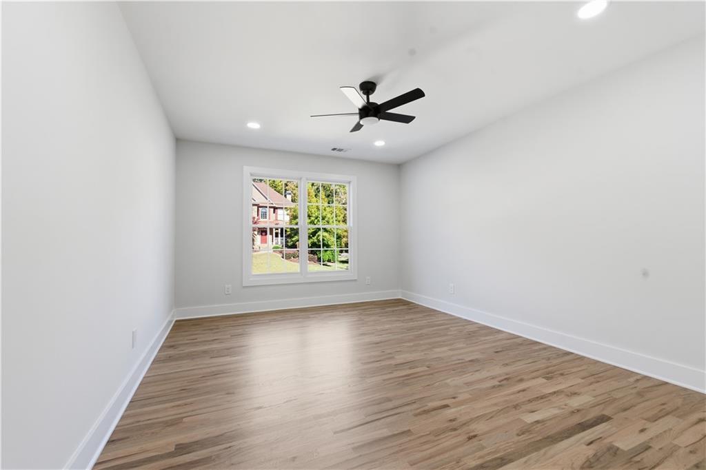 435 Lakepoint Trace Canton, GA 30114 - Photo 27 of 80 wooden floor in an empty room with a window
