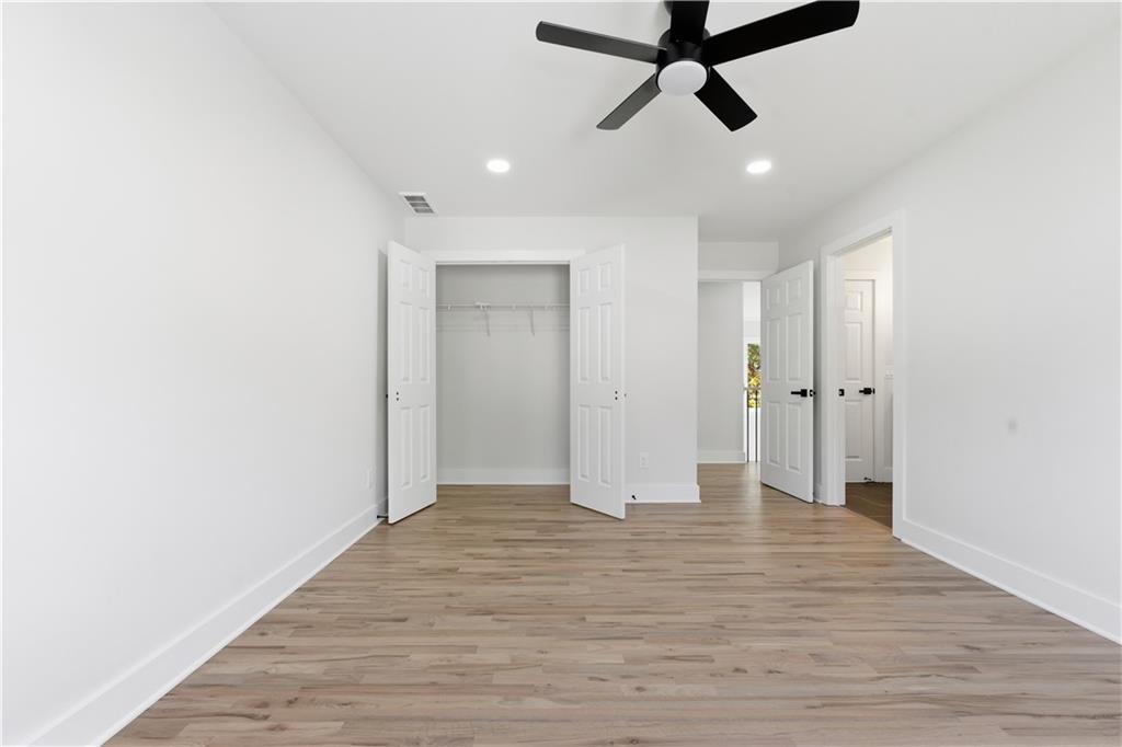 435 Lakepoint Trace Canton, GA 30114 - Photo 28 of 80 a view of an empty room with wooden floor