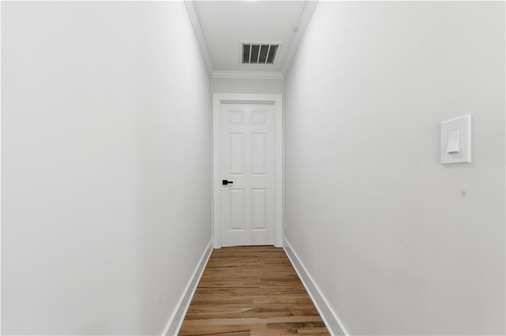 435 Lakepoint Trace Canton, GA 30114 - Photo 33 of 80 a view of a hallway with wooden floor
