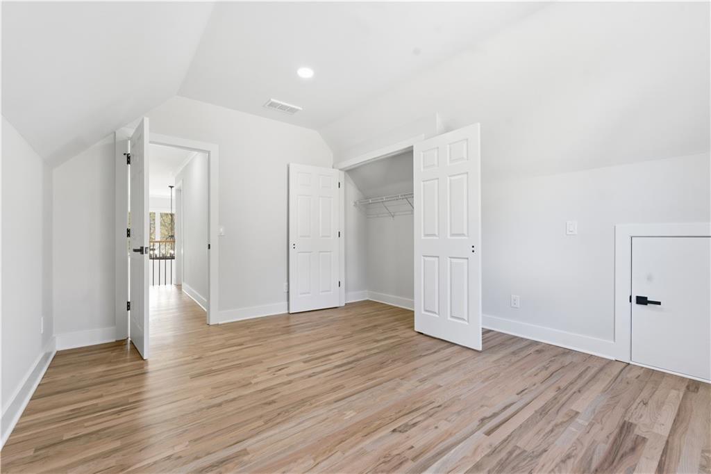 435 Lakepoint Trace Canton, GA 30114 - Photo 37 of 80 a view of an empty room with wooden floor and window