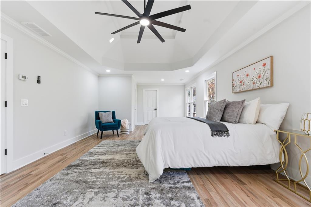 435 Lakepoint Trace Canton, GA 30114 - Photo 39 of 80 a spacious bedroom with a bed and a table