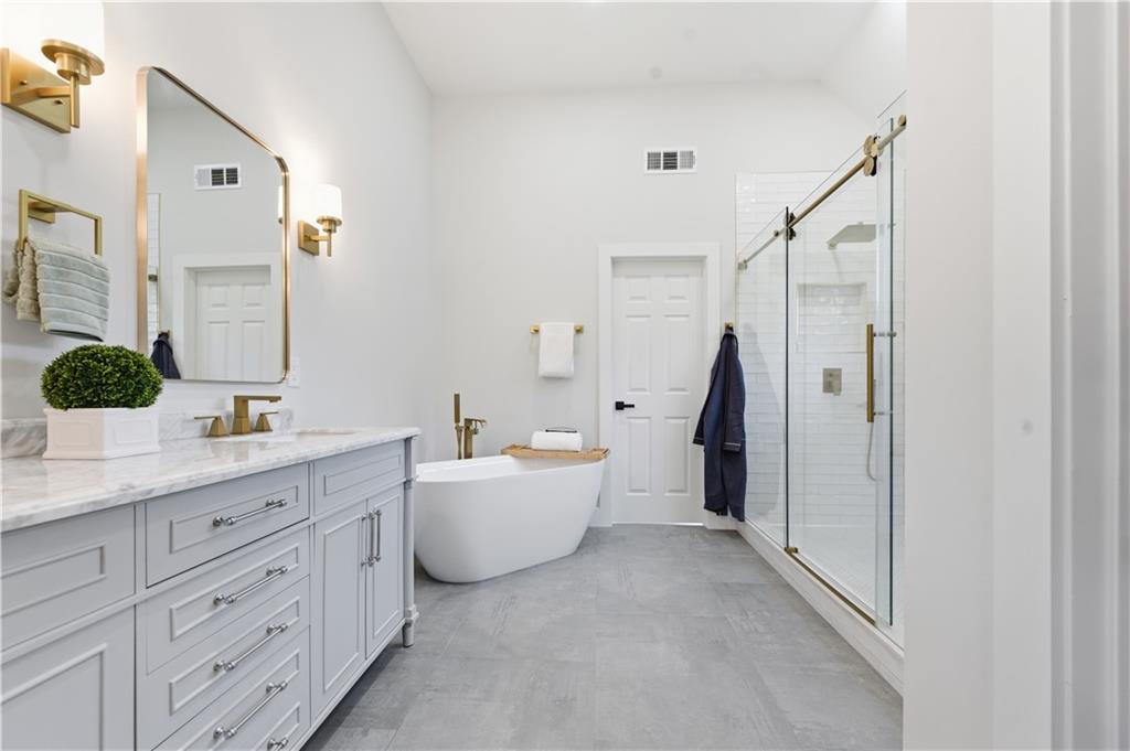 435 Lakepoint Trace Canton, GA 30114 - Photo 41 of 80 a bathroom with a granite countertop sink mirror and bathtub
