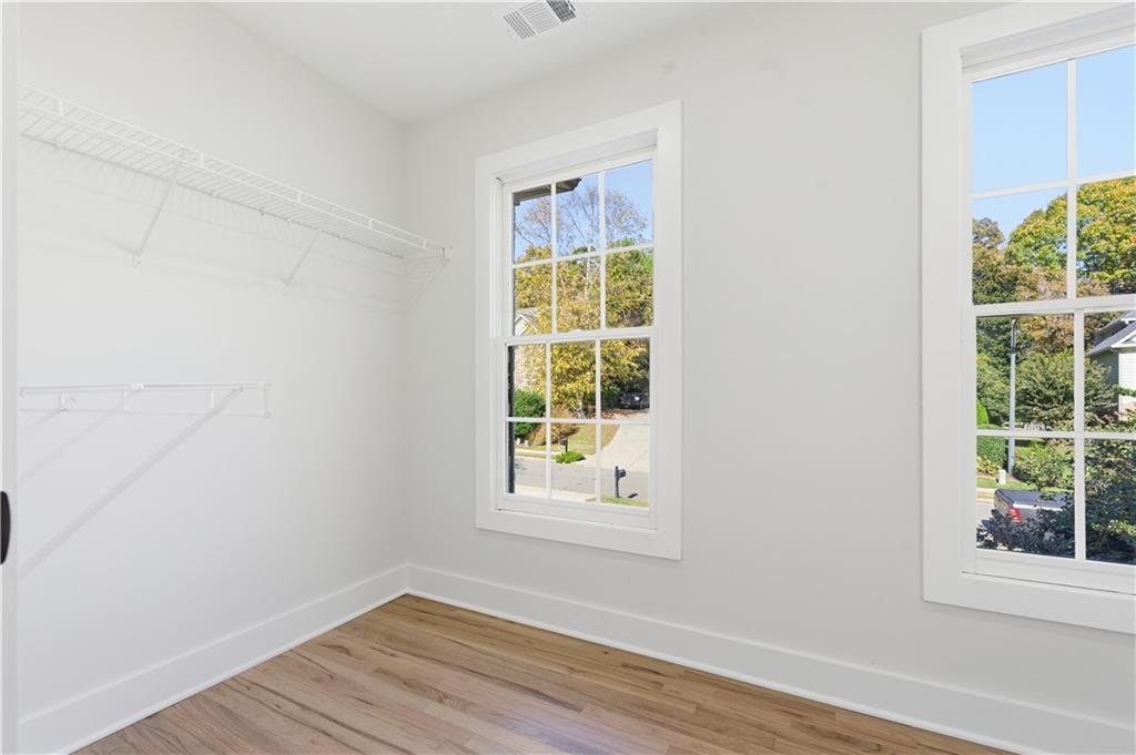 435 Lakepoint Trace Canton, GA 30114 - Photo 52 of 80 an empty room with wooden floor and windows