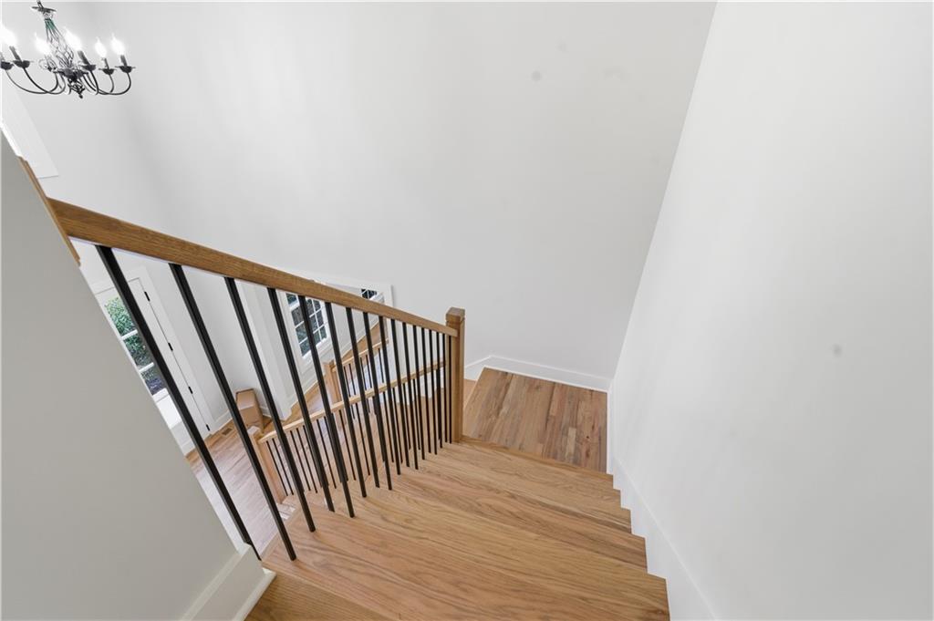435 Lakepoint Trace Canton, GA 30114 - Photo 56 of 80 a view of a hallway with wooden floor