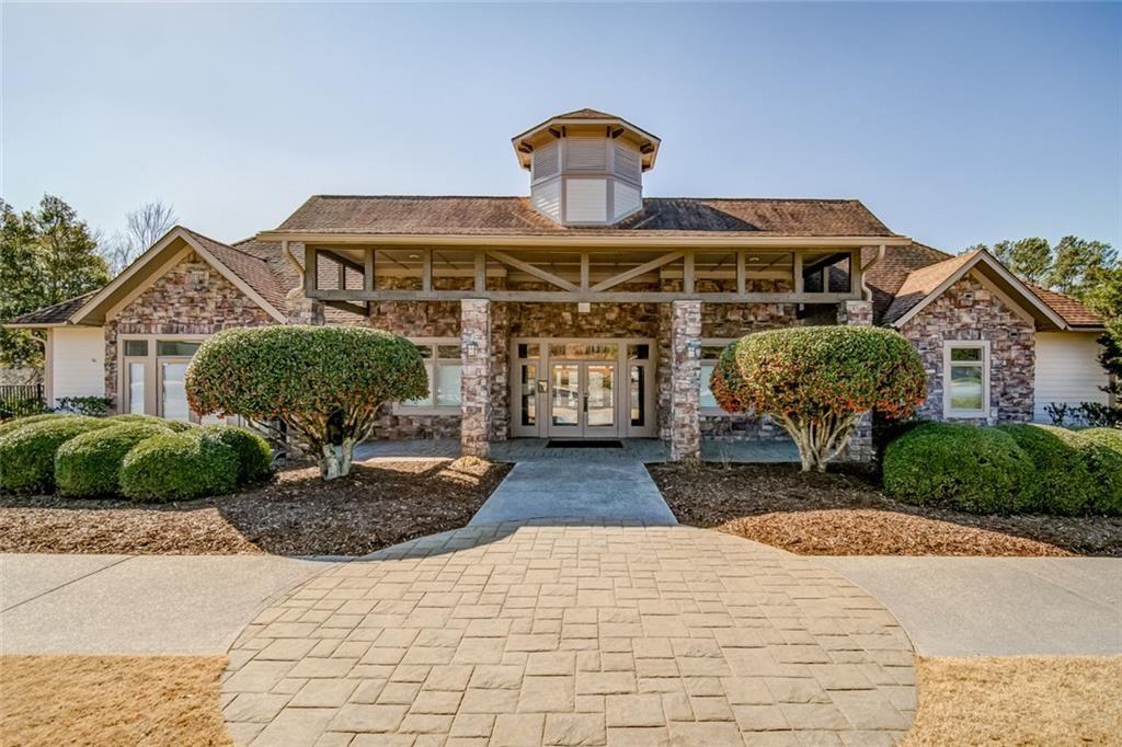 435 Lakepoint Trace Canton, GA 30114 - Photo 76 of 80 a front view of a house with garden