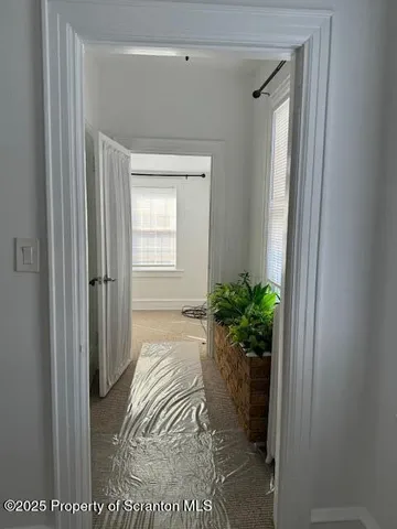 a view of entryway with wooden floor