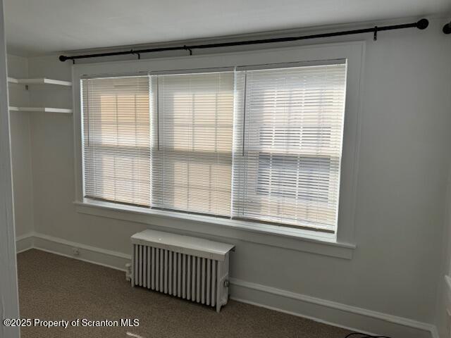 428 Wheeler Avenue, Unit 2 Scranton, PA 18510 - Photo 8 of 17 a view of a bedroom with a chair and a window