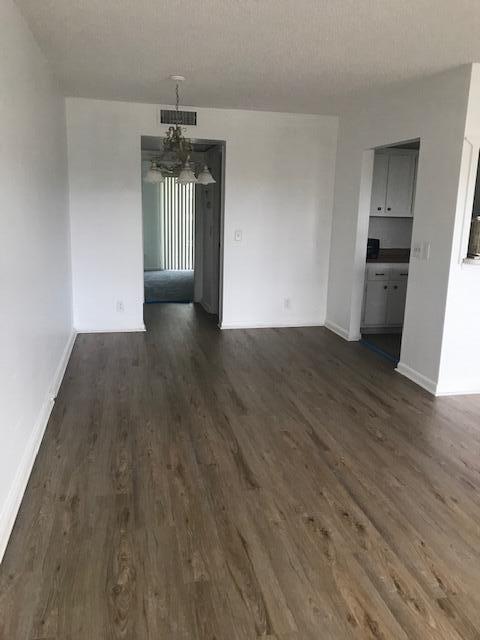 324 Mansfield H Boca Raton, FL 33434 - Photo 2 of 10 a view of a kitchen with a sink and dishwasher wooden floor
