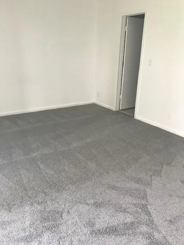 a view of a livingroom with a floor to ceiling window