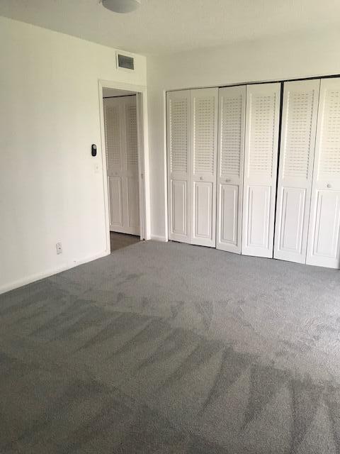 324 Mansfield H Boca Raton, FL 33434 - Photo 7 of 10 a view of an empty room with closet area