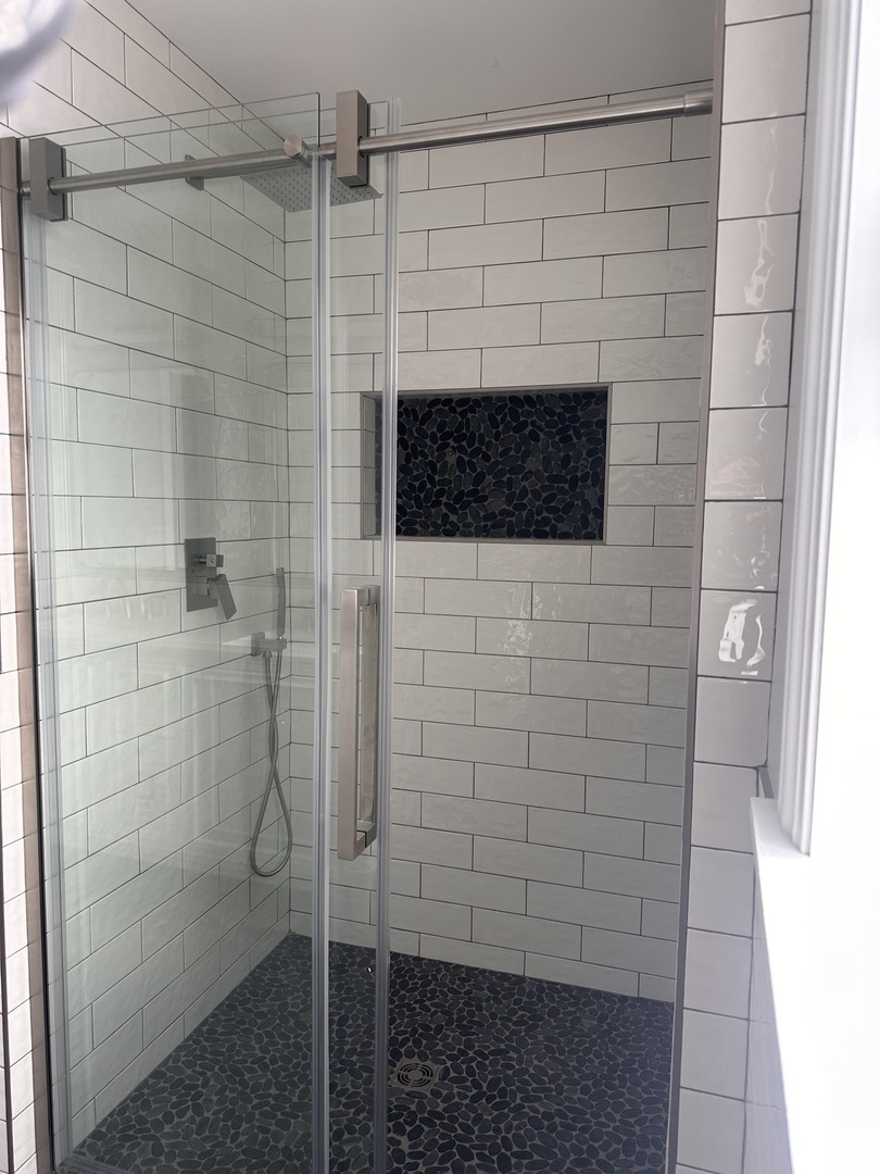 8017 South Kostner Avenue Chicago, IL 60652 - Photo 13 of 17 a bathroom with a shower and a tiled wall