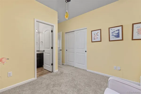a view of a hallway with bathroom