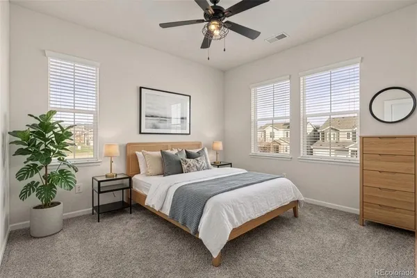 a bathroom with a granite countertop sink a large mirror and a