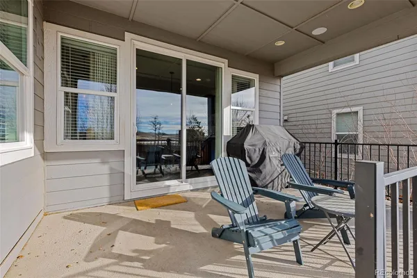 a view of a balcony with chairs