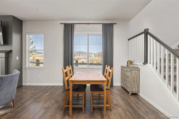 a dining room with furniture and window