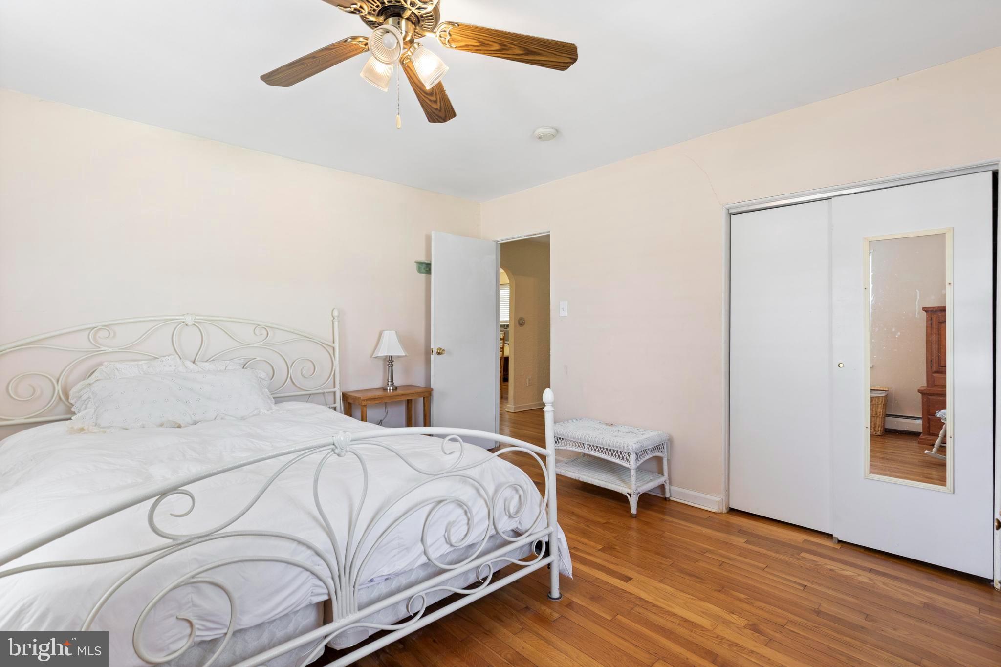 1001 Primos Avenue Secane, PA 19018 - Photo 11 of 27 a bedroom with a bed and a chandelier