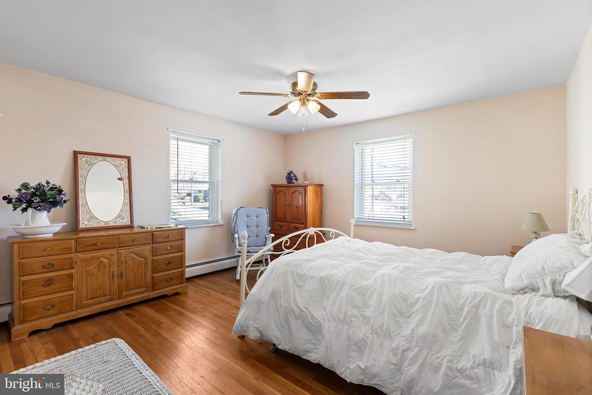 1001 Primos Avenue Secane, PA 19018 - Photo 12 of 27 a bedroom with a bed and wooden floor