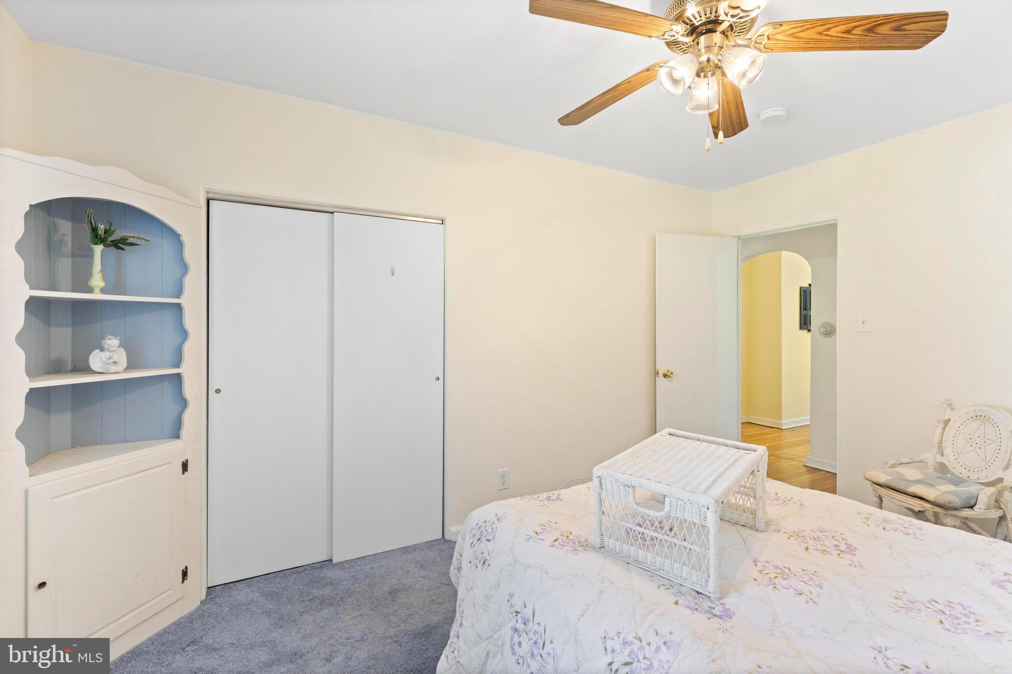 1001 Primos Avenue Secane, PA 19018 - Photo 14 of 27 a bedroom with a bed and a chandelier