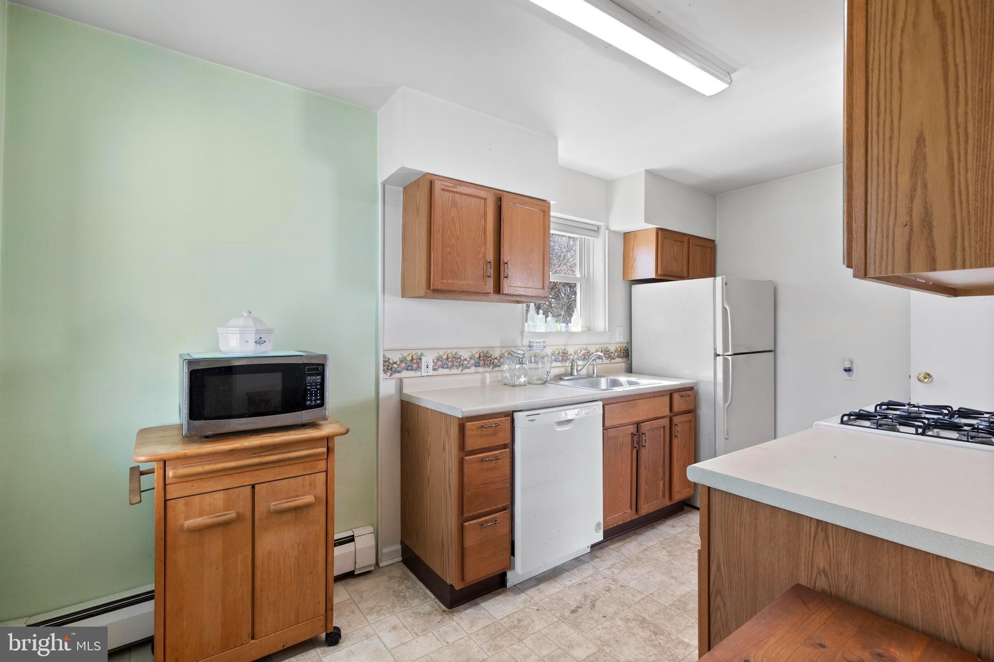 1001 Primos Avenue Secane, PA 19018 - Photo 8 of 27 a kitchen with a sink stove and refrigerator