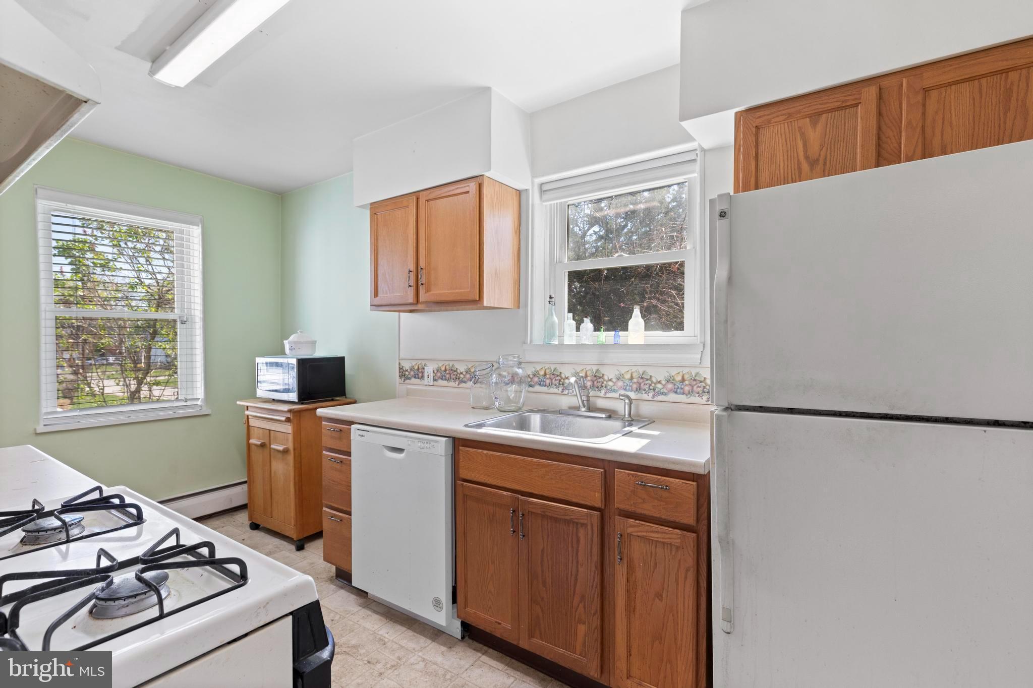 1001 Primos Avenue Secane, PA 19018 - Photo 9 of 27 a kitchen with a sink stove and refrigerator