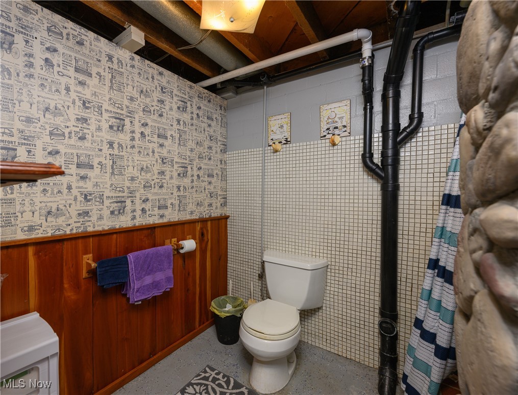 3015 Avalon Road Northwest Carrollton, OH 44615 - Photo 32 of 35 Bathroom with a shower and wainscoting
