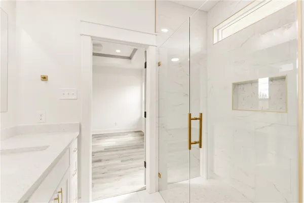 a bathroom with a shower and a tub