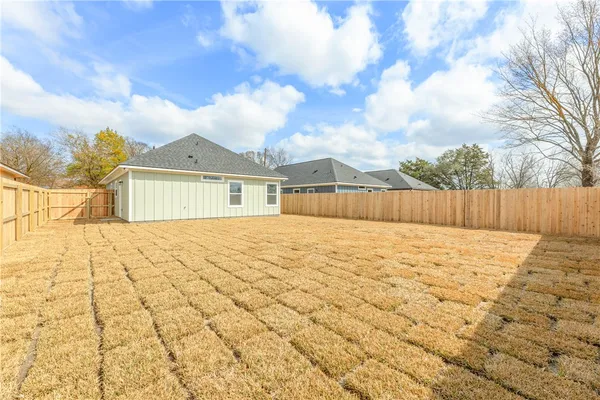 a view of a backyard of the house