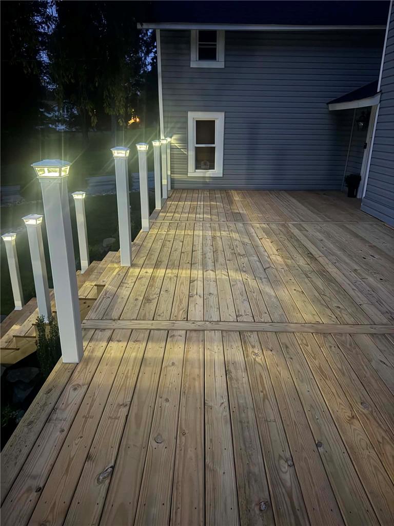 164 Sand Spring Road Cresco, PA 18326 - Photo 12 of 60 A spacious wooden deck provides ample outdoor living space, perfect for entertaining.
