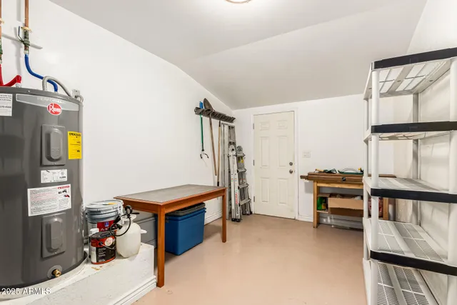 a bedroom with furniture and a window